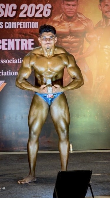 Jeya Surya competing on stage as a bodybuilder in Chennai